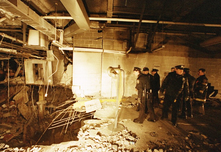 FILE - In this file photo of Feb. 27, 1993, police and firefighters inspect the bomb creater inside an underground parking garage of New York's World Trade Center the day after an explosion tore through it. Twenty years ago a group of terrorists blew up explosives under one of the towers, killing six people and ushering in an era of terrorism on American soil.(AP Photo/Richard Drew, File)