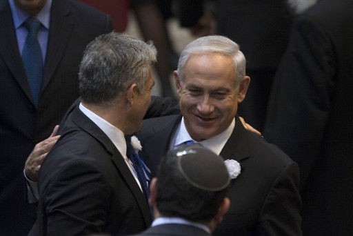  Israel's Prime Minister Benjamin Netanyahu (R) and Yair Lapid (L), head of Yesh Atid (There is a Future) party embrace after the swearing-in ceremony of the 19th Knesset, the new Israeli parliament, in Jerusalem, Israel, 05 February 2013. EPA/RONEN ZVULUN / POOL