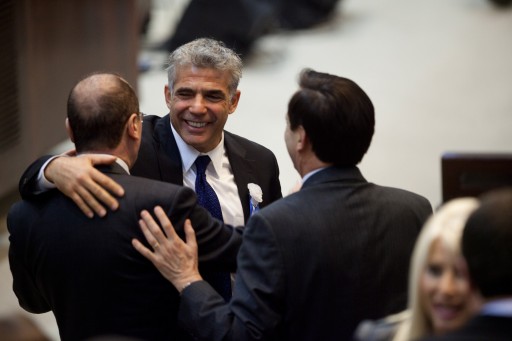 Yair Lapid (C), leader of the Yesh Atid (there is A Future) attends the swearing-in ceremony of the 19th Knesset, the new Israeli parliament, in Jerusalem, Israel, 05 February 2013. EPA/URIEL SINAI / POOL