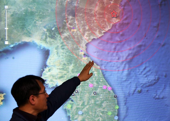 A quake official at the Korea Meteorological Agency (KMA) in Seoul points to North Korea's northeastern county of Kilju, where the communist country apparently conducted a nuclear test on 12 February 2013. EPA/YONHAP 