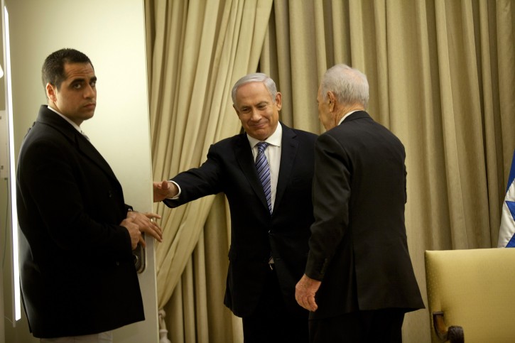 Israeli Prime Minister Benjamin Netanyahu, center, and Israeli President Simon Peres leave after a brief ceremony in the president's residence, on Saturday, March 2, 2013 in Jerusalem, Israel. (AP Photo/Uriel Sinai, Pool)
