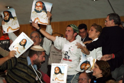File photo of protesters raise posters of Jonathan Pollard during a meeting of the General Assembly of United Jewish Communities of North America in Jerusalem on Sunday night, 16 November 2003. EPA/JIM HOLLANDER 