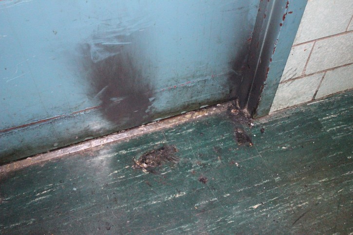 the aftermath of a Mezuzah that was burned. Credits: Roy Renna / BMR Breaking News/VINNews.com