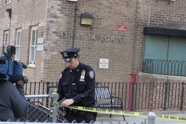 An NYPD Police Officers closes off the main entrence of the building while HATE CRIMES UNIT investigates. Credits: Roy Renna / BMR Breaking News/VINNews.com