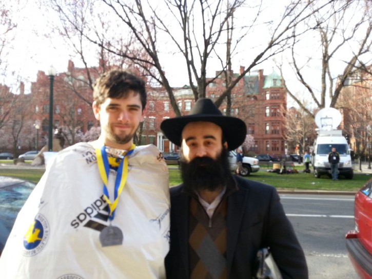 Rabbi Yossi Zaklos wrapping tefillin 2 blocks away from explosions