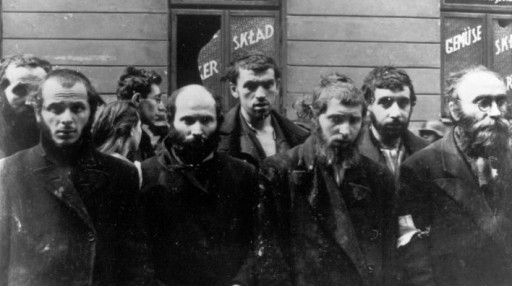 In this April/May 1943 file photo, a group of religious Jews are being held under arrest by German SS soldiers during the destruction of the Warsaw Ghetto by German troops, following an uprising in the Jewish quarter. Friday, April 19, 2013 anniversary of the start of the Warsaw ghetto uprising, a revolt that ended in death for most of the fighters yet gave the world an enduring symbol of resistance against the odds. (AP Photo)