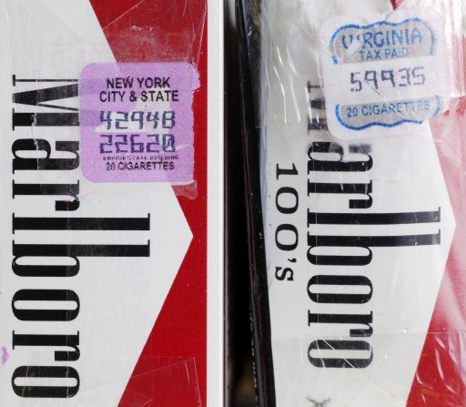 In this Tuesday, April 30, 2013 photo, two packs of Marlboro cigarettes, the one on the left with a New York City and state tax stamp, and on the right a Virginia tax stamp, are displayed for a photo, in New York. New York Citys war on smoking is being undercut by light penalties for merchants caught selling cheap cigarettes smuggled in from low-tax states. (AP Photo/Mark Lennihan)