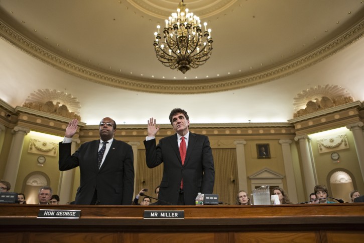 Ousted IRS chief Steven Miller, right, and J. Russell George, the Treasury inspector general for tax administration, are sworn in on Capitol Hill, in Washington, Friday, May 17, 2013, prior to testifying before the House Ways and Means Committee hearing on the extra scrutiny the IRS gave Tea Party and other conservative groups that applied for tax-exempt status.  (AP Photo/J. Scott Applewhite)