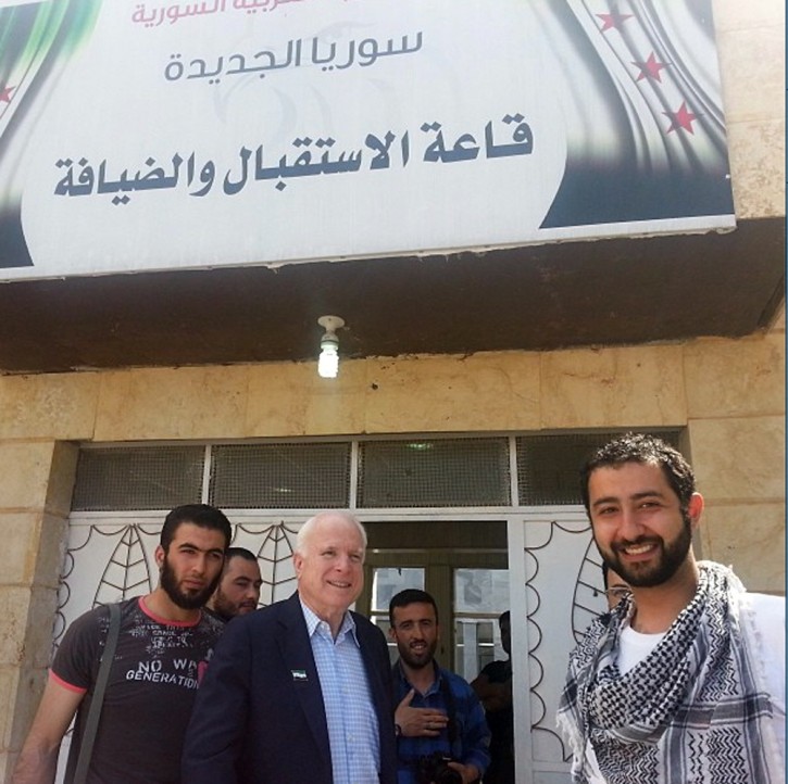In this Monday, May 27, 2013 photo provided by Mouaz Moustafa and the Syrian Emergency Task Force, Sen. John McCain, R-Ariz., center, accompanied by Moustafa, right, visits rebels in Syria. (AP Photo/Syrian Emergency Task Force, Mouaz Moustafa)