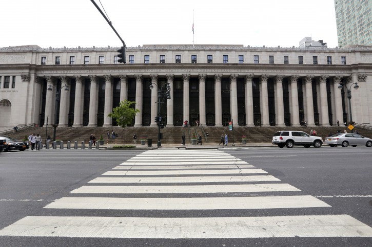 This May 9, 2013 photo shows the James A. Farley Post Office building which is slated to be the site of the future home of Moynihan Station, in New York. The project has become a long-stagnant promise for a massive Amtrak main terminal, with ticketing and waiting areas plus retail shops. The new station would be named after Daniel Patrick Moynihan, the late New York senator who envisioned it. (AP Photo/Mary Altaffer)