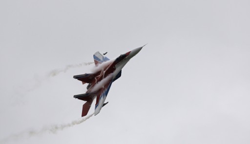 FILE - In this Friday, Aug. 21, 2009 file photo, a Russian-made MiG-29 jet fighter flown by the aerobatic team Strizhi (Swifts) perform during MAKS (the International Aviation and Space Show) in Zhukovsky, outside Moscow, Russia. Russian arms manufacturer MiG told Russian news agencies Friday, May 31, 2013 that it is signing a contract to deliver at least 10 fighter jets to Syria. (AP Photo/Sergey Ponomarev, File)