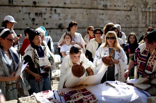 FILE - An Israeli Jewish woman lays down a Torah scroll (C) during a prayer session near the Western Wall in the Old City of Jerusalem, Israel, 12 March 2013. The prayers, attended by hundreds of women, marked the beginning of the Hebrew month of Nisan.  EPA/ABIR SULTAN