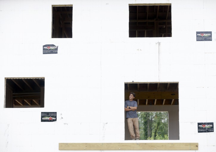 Anthony Aebi of Greenhill Contracting poses in a zero net energy home that is under construction at the Preserve at Mountain Vista on Tuesday, July 9, 2013, in New Paltz, N.Y. (AP Photo/Mike Groll)