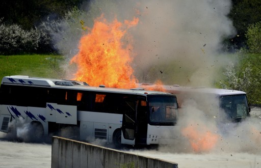 FILE - Flames burst from a detonating bus during the reenactment of the Burgas bus bombing near the town of Ihtiman, some 50 kilometers from Sofia, Bulgaria, 26 April 2013. Bulgarian authorities reenacted the 18 July 2012 Burgas bus which killed five Israeli tourists, their Bulgarian bus driver and the terrorist himself. EPA