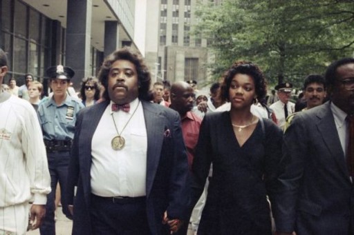 The Rev. Al Sharpton, left, and Tawana Brawley walk to hold a news conference outside at Federal Court in Manhattan in this 1990 file photo. (The Associated Press)