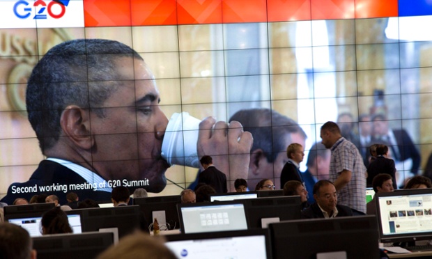 President Barack Obama drinking coffee shown on a large screen in the media centre of the G20 summit in Saint Petersburg, Friday 6 September 2013. Photograph: Virginia Mayo/AP