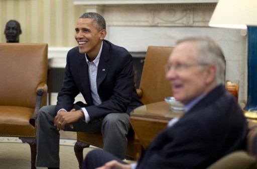 U.S. President Barack Obama meets U.S. Senate Democrats including Senate Majority Leader Harry Reid (D-NV) (R) in the Oval Office of the White House in Washington, October 12, 2013. REUTERS/Jason Reed