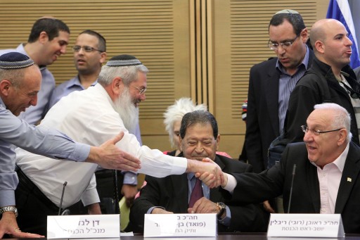 FILE - Rabbi ELiyahu ben Dahan of the "haBayit haYehudi" party seen shaking hands with chairman of the Israeli parliament Reuven Rivlin during an introduction day for new parliament members, in the Israeli parliament (knesset) on February 03, 2013. Photo by Miriam Alster/FLASH90 