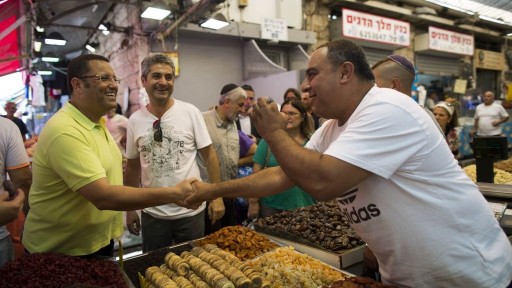Moshe Lion (L) visits the Mahane Yehuda market in central Jerusalem, August 5, 2013. (photo credit: Yonatan Sindel/Flash90)