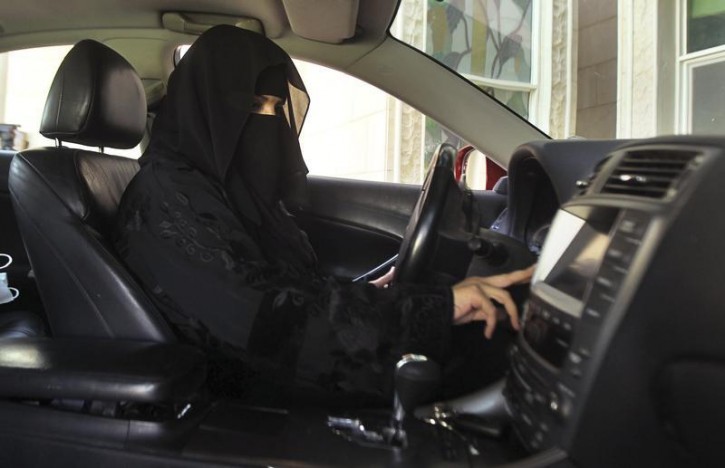 A woman drives a car in Saudi Arabia October 22, 2013. A conservative Saudi Arabian cleric has said women who drive risk damaging their ovaries and bearing children with clinical problems, countering activists who are trying to end the Islamic kingdom's male-only driving rules. Saudi Arabia is the only country in the world where women are barred from driving, but debate about the ban, once confined to the private sphere and social media, is increasingly spreading to public forums too. REUTERS/Faisal Al Nasser (
