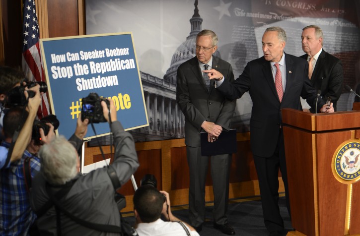 US Senator from New York Charles Schumer (2L), with US Senate Majority Leader Democratic Senator from Nevada Harry Reid (L) and Democratic Senator from Illinois Richard Durbin (R), delivers remarks during a press conference in the US Capitol in Washington, DC, USA, 03 October 2013. EPA/SHAWN THEW