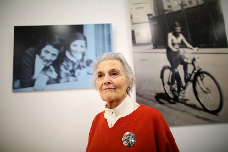 Contemporary witness Lore Robinson stands in front of pictures from her childhood in Cologne, Germany, 16 October 2013. The exhibition 'Children leave at 17.13' about the rescue transports of Jewish children from Cologne to London in the years 1938 and 1939 runs from 16 October to 24 November.  EPA/Oliver Berg