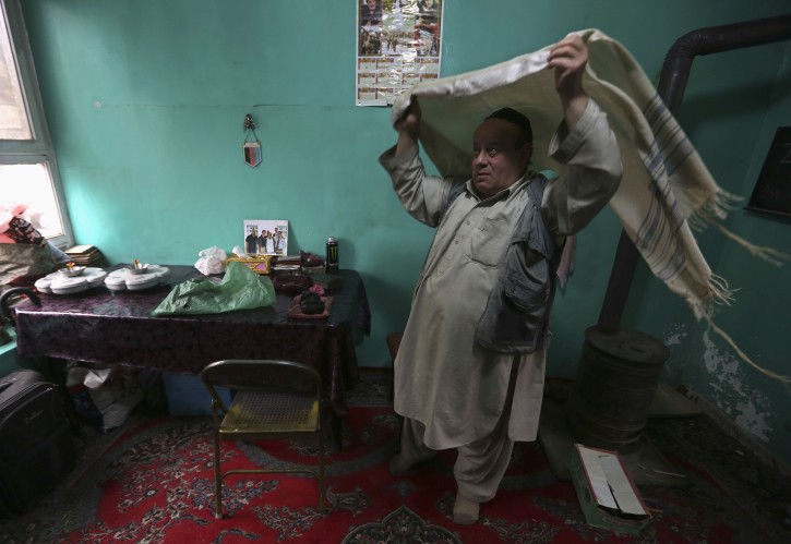 November 12, 2013Zabulon Simintov, an Afghan Jew, prepares for prayers at his residence in Kabul November 5, 2013. In his 50s, Simintov is the last known Afghan Jew to remain in the country. He has become something of a celebrity over the years and his rivalry with the next-to-last Jew, who died in 2005, inspired a play. Picture taken November 5, 2013.