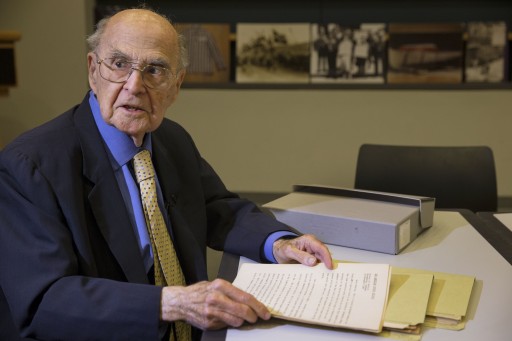 Harold Burson, 92, donates a never-before-published transcript of coverage of the Nuremberg trials to the U.S. Holocaust Memorial Museum in Washington on Tuesday Nov. 19, 2013. (AP Photo/Jacquelyn Martin)