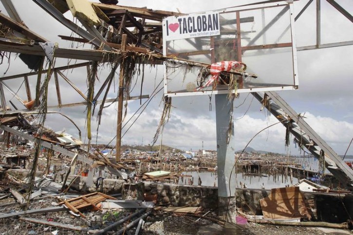 Debris hang on a basketball post near thousands of houses damaged after super Typhoon Haiyan battered Tacloban city, central Philippines November 10, 2013. Reuters