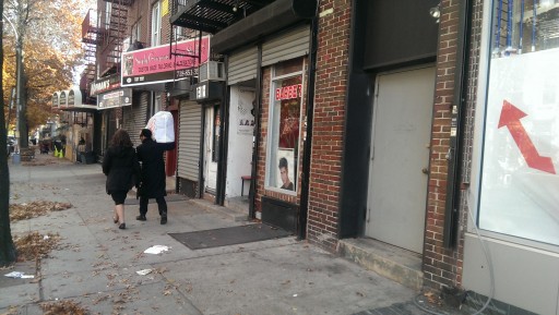 An Orthodox couple is seen passing by on Nov. 10 , 2013, near the barber shop in Borough Park section of Brooklyn, NY at 1310 41st Street where an alleged sex crime occurred.(courtesy)