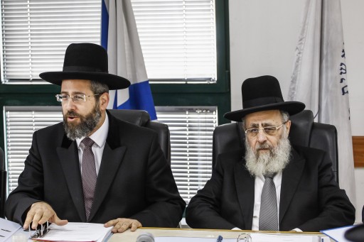FILE - Chief Ashkenazi Rabbi David Lau (L) and Sephardi Chief Rabbi Yitzhak Yosef attend a meeting of the Rabbinate Council in Jerusalem on November 04, 2013. Photo by Flash90