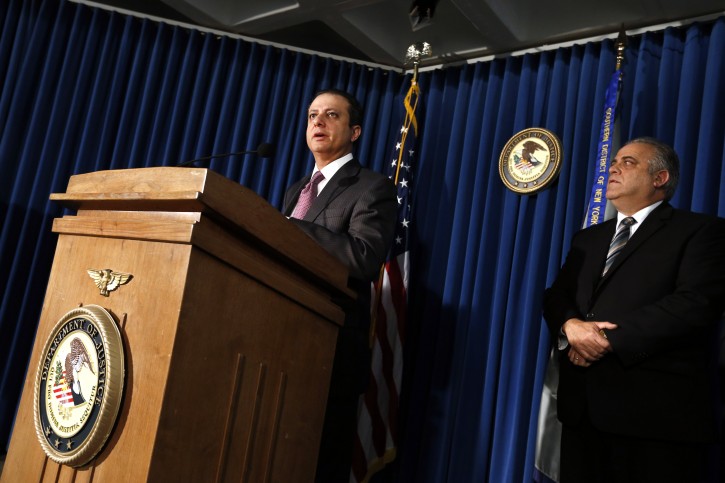 U.S. Attorney Preet Bharara, left, announces charges against more than a dozen Russian diplomats and their spouses living in New York during a news conference Thursday, Dec. 5, 2013 in New York.  The charges stem from the defendants' alleged involvement in a $1.5 million fraud of a U.S. government health program for the poor. (AP Photo/Jason DeCrow)