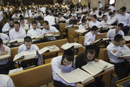 FILE -  Ultra-Orthodox Jewish men study at Jerusalem's Mir Yeshiva, the largest Jewish seminary in Israel July 4, 2012.  Reuters