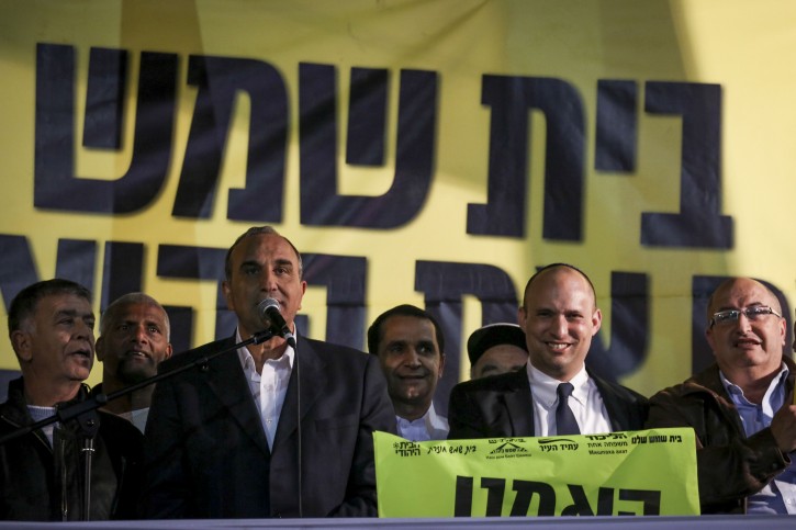 Defeated Bet Shemesh mayoral candidate Eli Cohen seen celebrating with Finance Minister, Naftali Bennett, among other ministers, outside the municipality in Bet Shemesh, inaugurating his new elections campaign on Monday, February 17, 2014. The District court annulled the original election results with evidence of widespread, coordinated and systematic fraud in the October municipal elections, leaving the ultra orthodox Shas candidate, Moshe Abutbul, as mayor. Photo by Hadas Parush/Flash90 