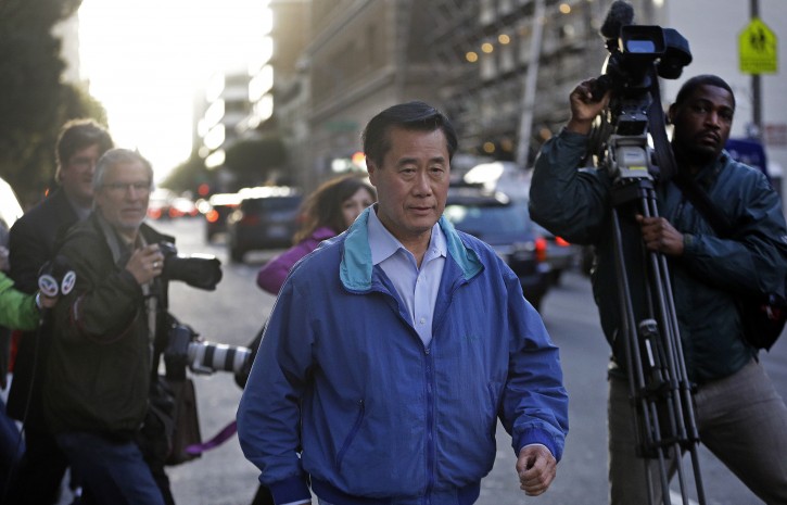 California Sen. Leland Yee, D-San Francisco, right, leaves the San Francisco Federal Building, Wednesday, March 26, 2014, in San Francisco.  The FBI has filed a 137-page affidavit outlining a detailed corruption case against Yee, who is accused of asking for campaign donations in exchange for introducing an undercover agent to an arms trafficker. (AP Photo/Ben Margot)