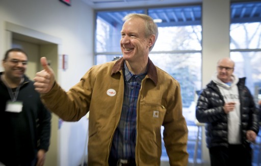 Illinois Republican gubernatorial candidate Bruce Rauner exits the polling place after voting on Tuesday, March 18, 2014, in Winnetka, Ill. Rauner faces State Sen. Bill Brady, State Sen. Kirk Dillard and State Treasurer Dan Rutherford in the primary election. (AP Photo/Andrew A. Nelles)