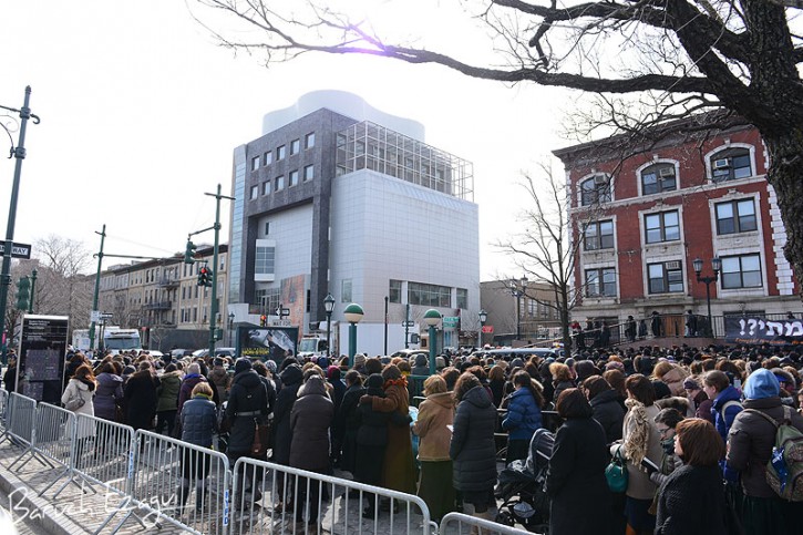On Thursday the funeral procession drives past Chabad headquarters at 770 . (Baruch Ezagui/VINnews.com)