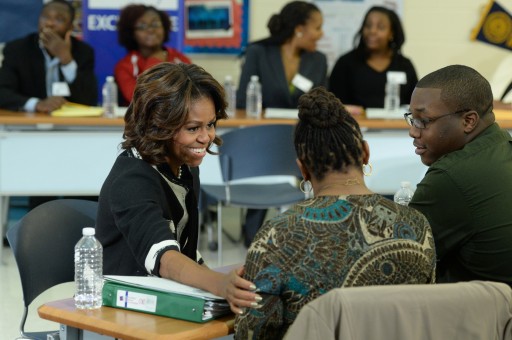 FILE - US First Lady Michelle Obama (L) speaks to students and parents during a FAFSA (Free Application for Federal Student Aid) workshop at the T.C. Williams High School in Alexandria, Virginia, USA, 05 February 2014.  EPA