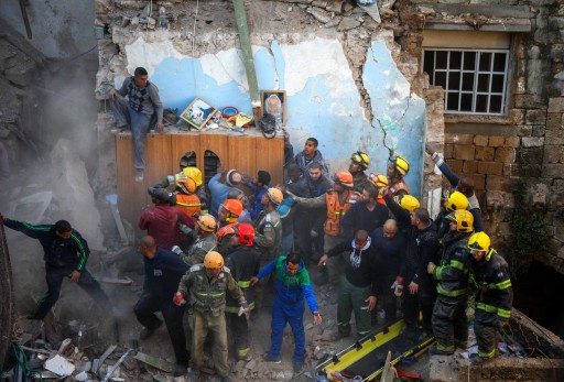 FILE - Israeli rescue personnel including soldiers from the Home Front Command and fire fighters, remove a body from the rubble of a home in the Old City of Acre, north of Haifa, Israel, 17 February 2014.  EPA