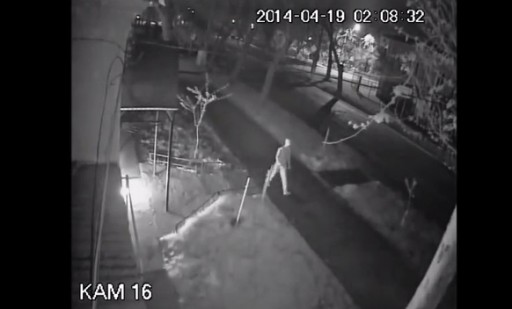Image grab from video footage, shows an unknown assailant walking away from Synagogue after trowing a Molotov cocktail