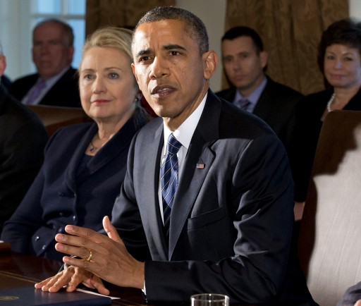 FILE - This Nov. 28, 2012 file photo shows then-Secretary of State Hillary Rodham Clinton listening as President Barack Obama speaks in the Cabinet Room at the White House in Washington. The White House confirmed that Hillary Clinton had lunch with President Obama Thursday. (AP Photo/Jacquelyn Martin, File)
