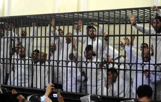 File: Supporters of the Muslim Brotherhood and ousted President Mohamed Morsi, on trial. Picture: REUTERS / Al Youm Al Saabi Newspaper / Files