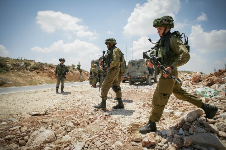 Israeli soldiers search the Palestinian territories around the Israeli settlement bloc of Gush Etzion, in the West Bank. Three Jewish teenagers hitchhiking in the West Bank have been missing since last night and are feared to have been kidnapped by terrorists, Israeli security officials said. June 13, 2014.  Photo by FLASH90 