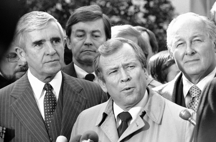 FILE - This Feb. 11, 1982 file photo shows Senate Majority Leader Howard Baker of Tenn., center, flanked by Sen. Paul Laxalt, R-Nev., left, and House Minority Leader Robert Michel of Ill. outside the White House in Washington following a meeting with President Ronald Reagan. Baker, who asked what President Richard Nixon knew about Watergate, has died. He was 88. Baker, a Republican, served 18 years in the Senate. He earned the respect of Republicans and Democrats alike and rose to the post of majority leader. He served as White House chief of staff at the end of the Reagan administration and was U.S. ambassador to Japan during President George W. Bush's first term. (AP Photo/Jeff Taylor, File)