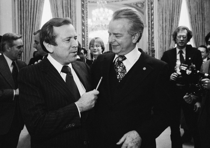 FILE - This Dec. 4, 1980 file photo shows Senate Majority Leader Robert Byrd of W.Va., right, talking to the man who will replace him, Sen. Howard Baker, R-Tenn., on Capitol Hill in Washington. Baker, who asked what President Richard Nixon knew about Watergate, has died. He was 88. Baker, a Republican, served 18 years in the Senate. He earned the respect of Republicans and Democrats alike and rose to the post of majority leader. He served as White House chief of staff at the end of the Reagan administration and was U.S. ambassador to Japan during President George W. Bush's first term. (AP Photo/Chick Harrity, File)