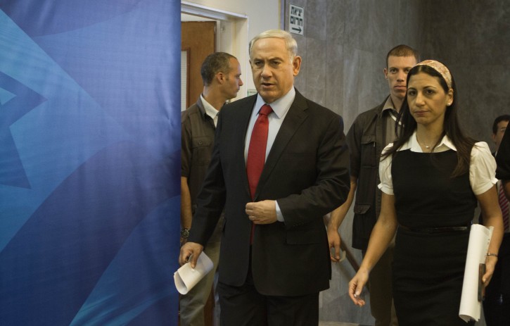  Israeli Prime Minister Benjamin Netanyahu (2-L) arrives for the cabinet meeting in Jerusalem, 29 June 2014. Since 12 June 2014 when three Israeli teenagers disappeared in the West Bank, the Gaza Strip has witnessed growing tensions with militants launching rockets and mortar shells into Israel and Israel responding with airstrikes.  EPA/DAN BALILTY / POOL