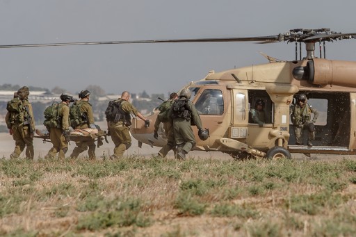 An injured Israeli soldier is evacuated by helicopter from near the Israeli border with Gaza Strip on July 21, 2014, following heavy fights between Israeli soldiers to Palestinian militants.  Flash90