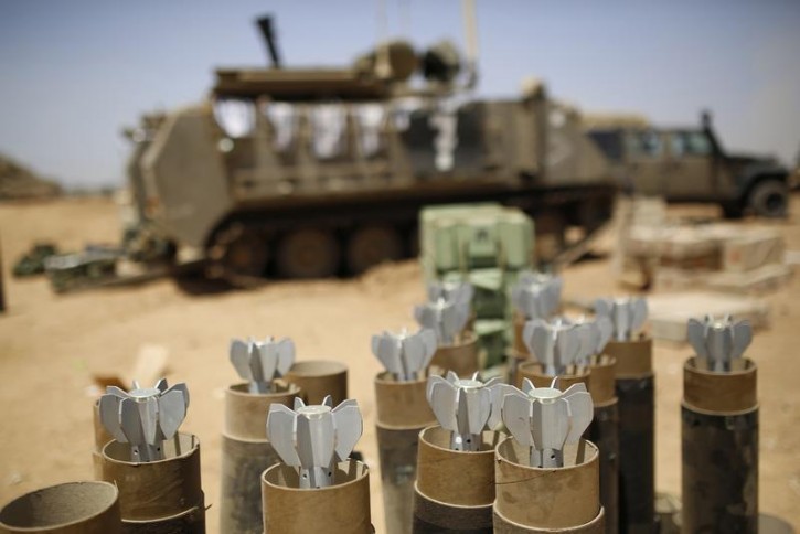 Mortar bombs are seen in containers at an Israeli military staging area near the border with Gaza July 30, 2014.  Reuters