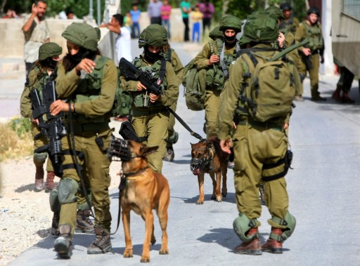 File: A group of Israeli soldiers on patrol in the West  Bank.  EPA/ABED AL HASHLAMOUN