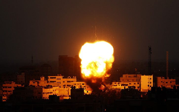 Explosion rises after Israeli air strikes in Gaza City, 20 August 2014. EPA/MOHAMMED SABER